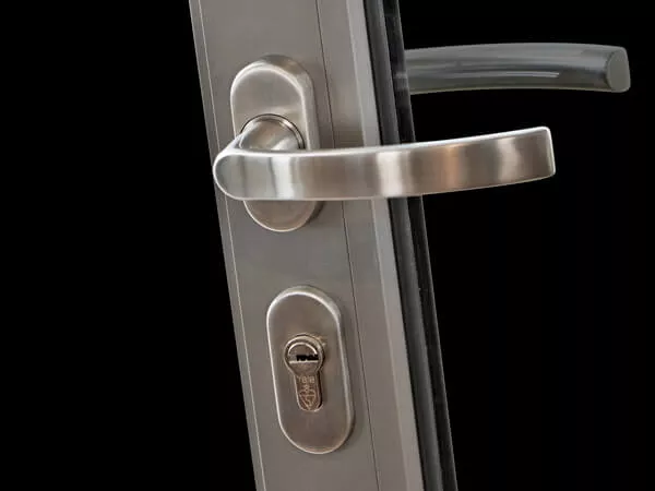 Bi-folding door security hardware